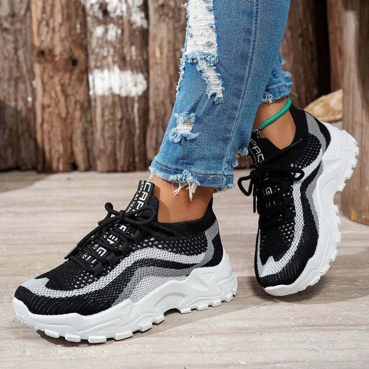 Stylish lightweight women's sports casual shoes by AdTec, black and white knit upper with chunky white sole