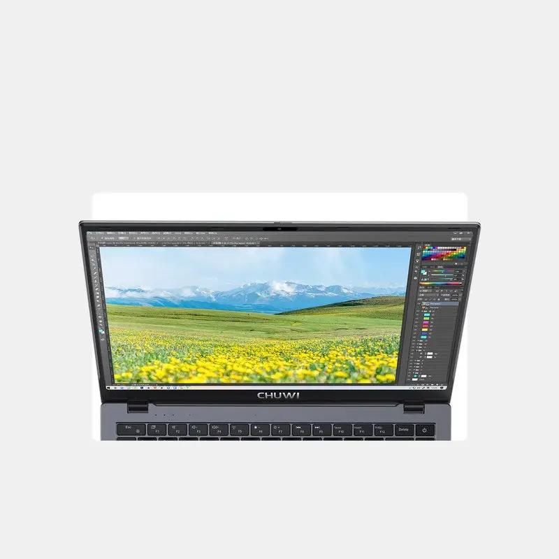 CHUWI laptop with dark gray chassis and open display showing scenic meadow and mountains