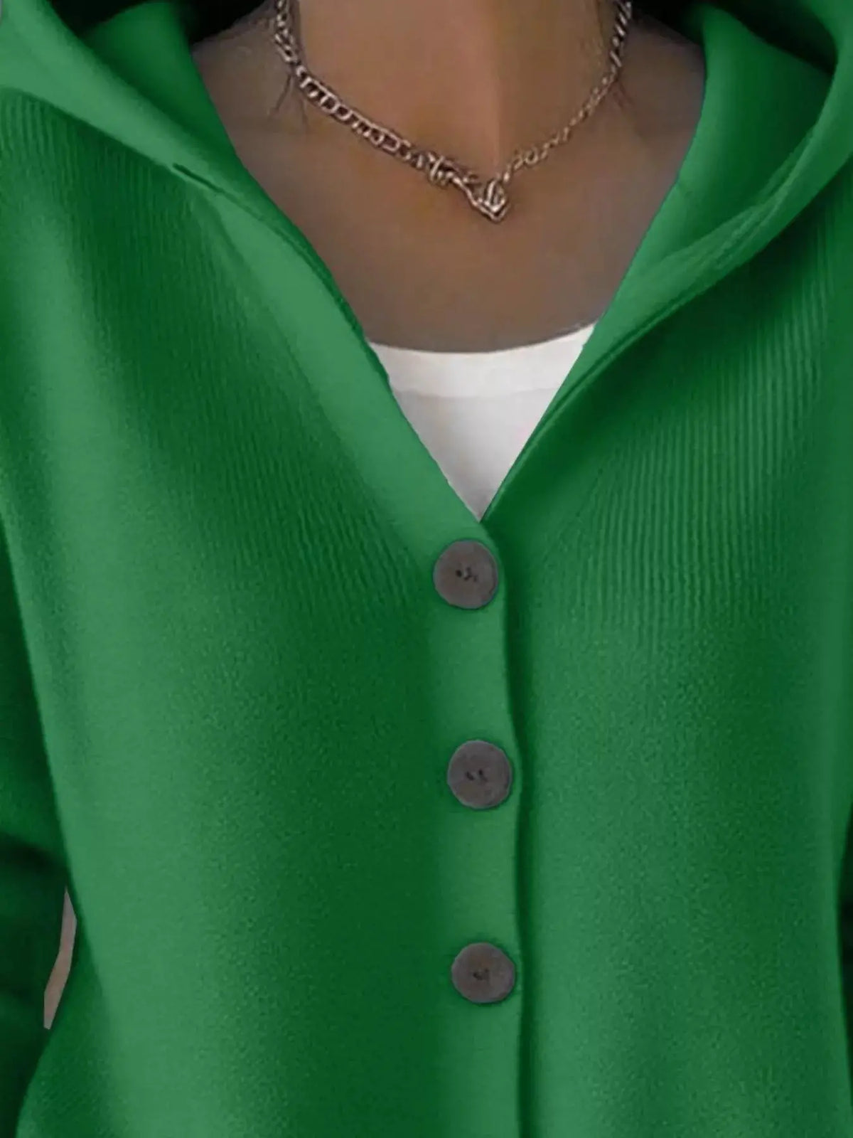 Plus size hooded button-front soft knit cardigan in green, worn over white top with silver necklace