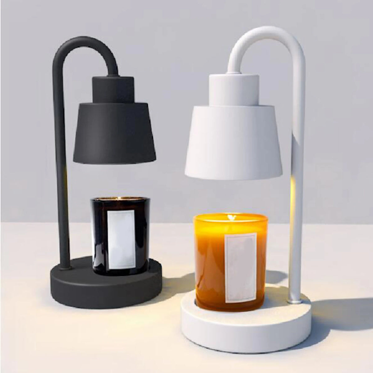 Candle warmer lamp set with two curved-neck lamps in black and white on a table.