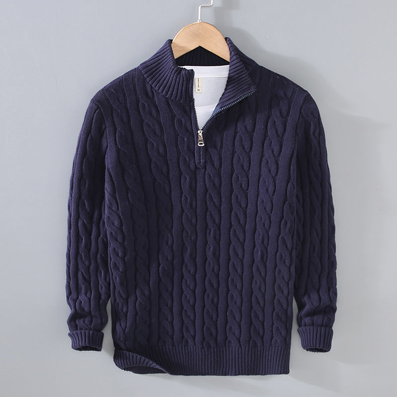 Men's navy blue thick cable-knit pullover sweater with half-zip mock neck and ribbed cuffs.