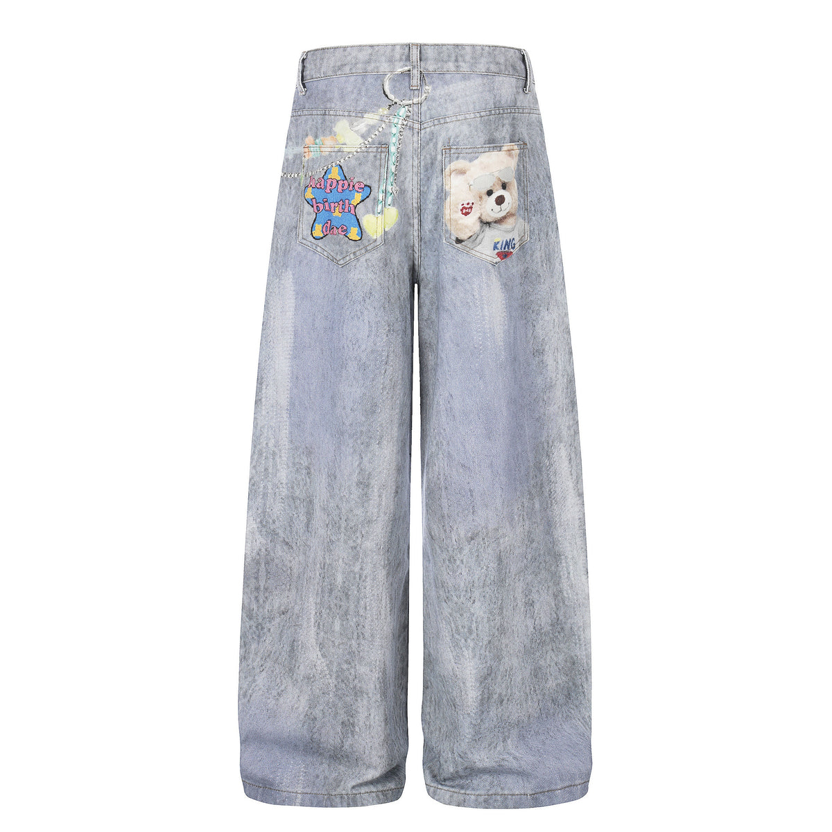 Bear-print blue denim jeans with colorful back-pocket patches; unisex wide-leg style.