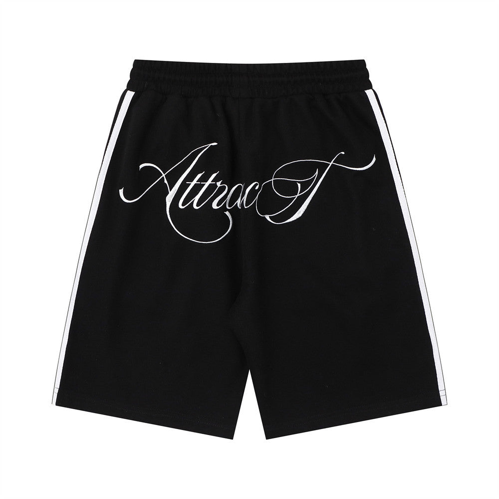 Hand-drawn letter print jogger shorts in black with white side stripes by eprolo