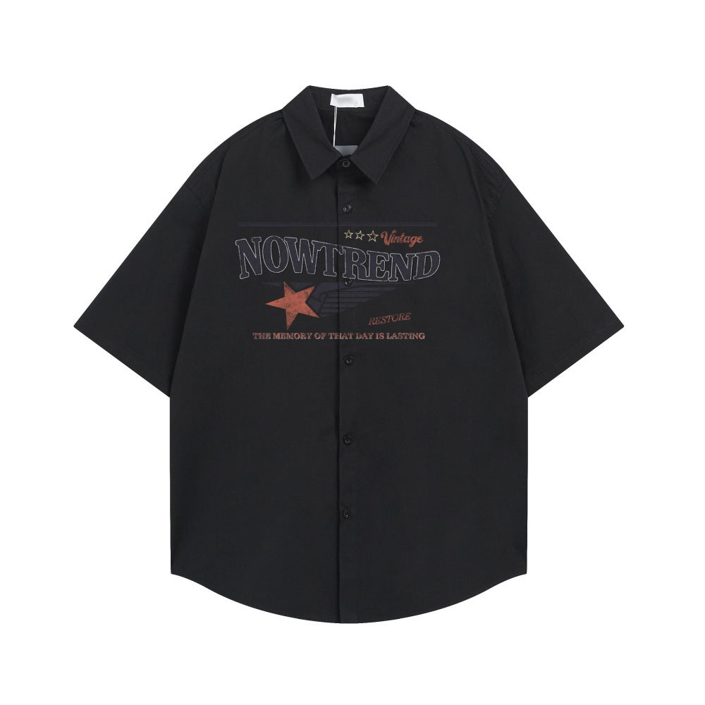 Short-sleeve black polyester shirt with NOW TREND graphic across chest.