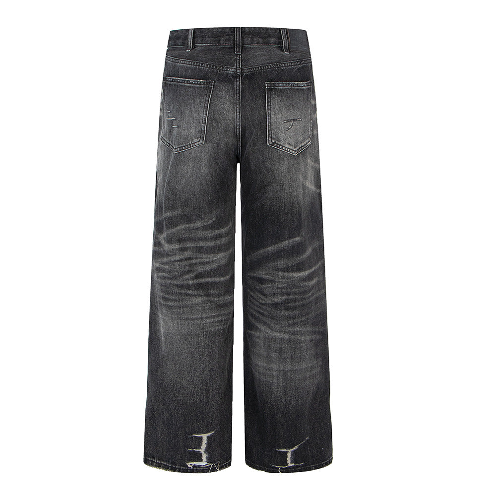 Distressed ripped washed vintage combat denim jeans by eprolo, back view with worn-in pockets
