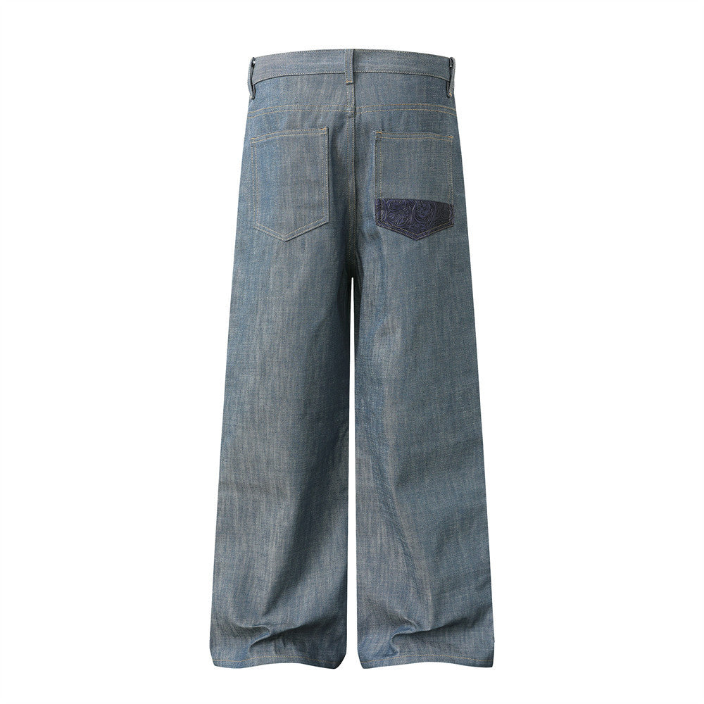 Make old wide leg jeans by eprolo, light blue denim with a purple patch on the right back pocket.
