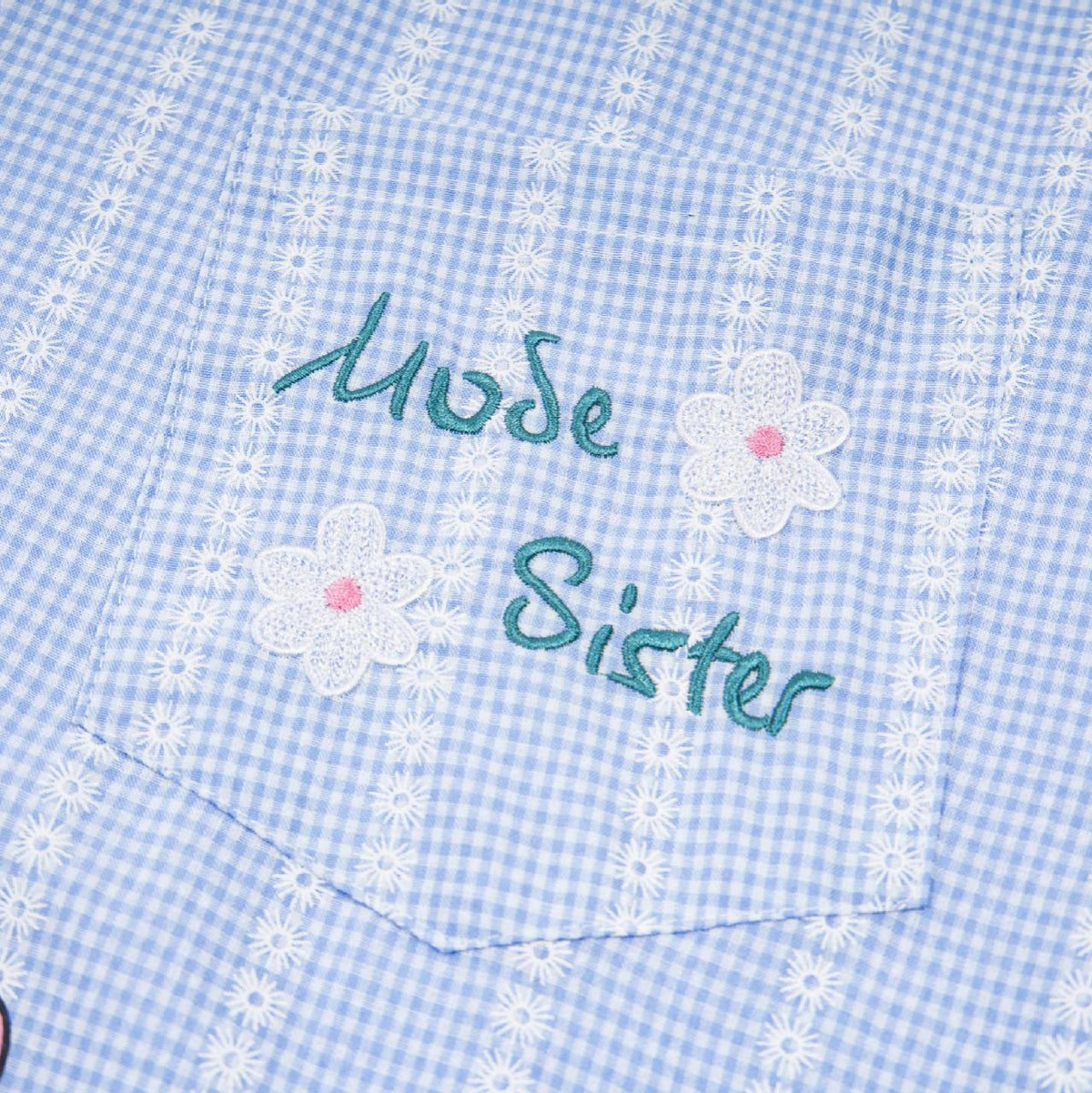 Shirt, blue gingham check, short-sleeved, pocket embroidery of daisies and teal text