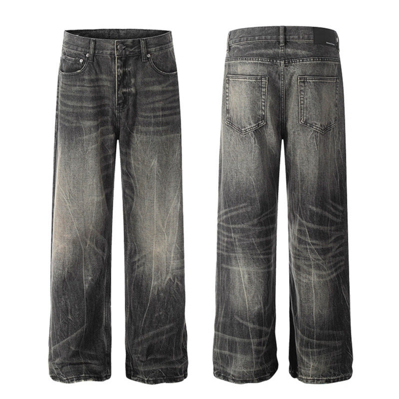 Washed denim jeans with dark faded whiskering; front and back views.