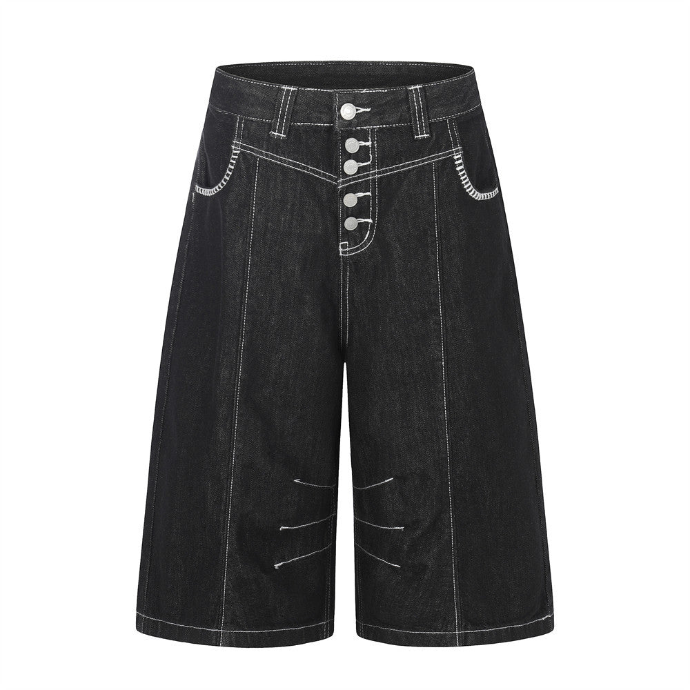 Black denim workwear shorts with contrast stitching and button fly.