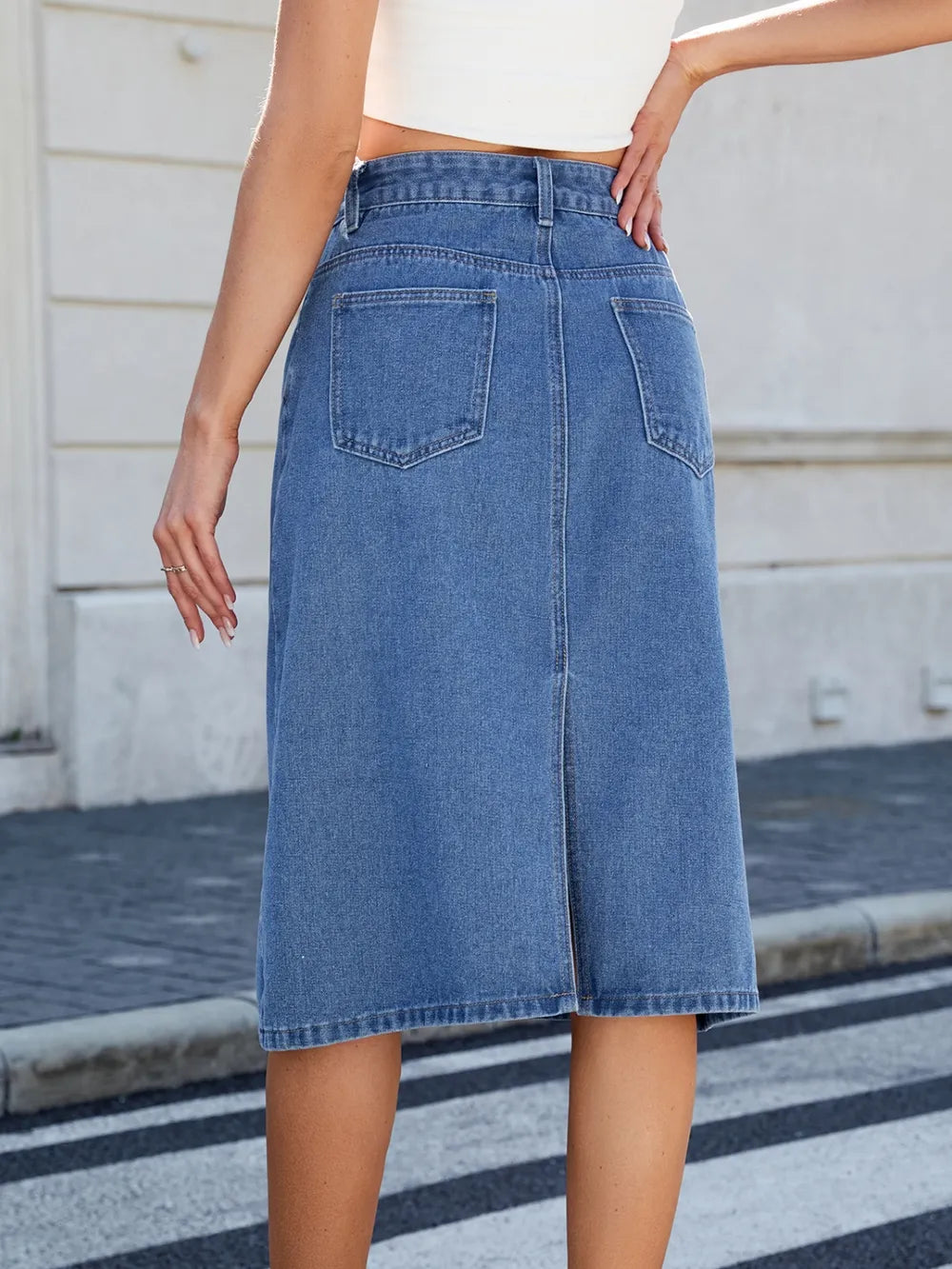 Slit-Back Midi Denim Skirt in blue denim with back pockets, midi length