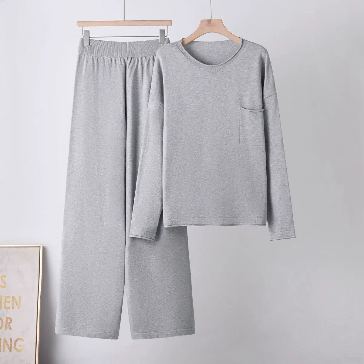 Women's gray two-piece sweater and wide-leg pants set with pockets, long-sleeve top.