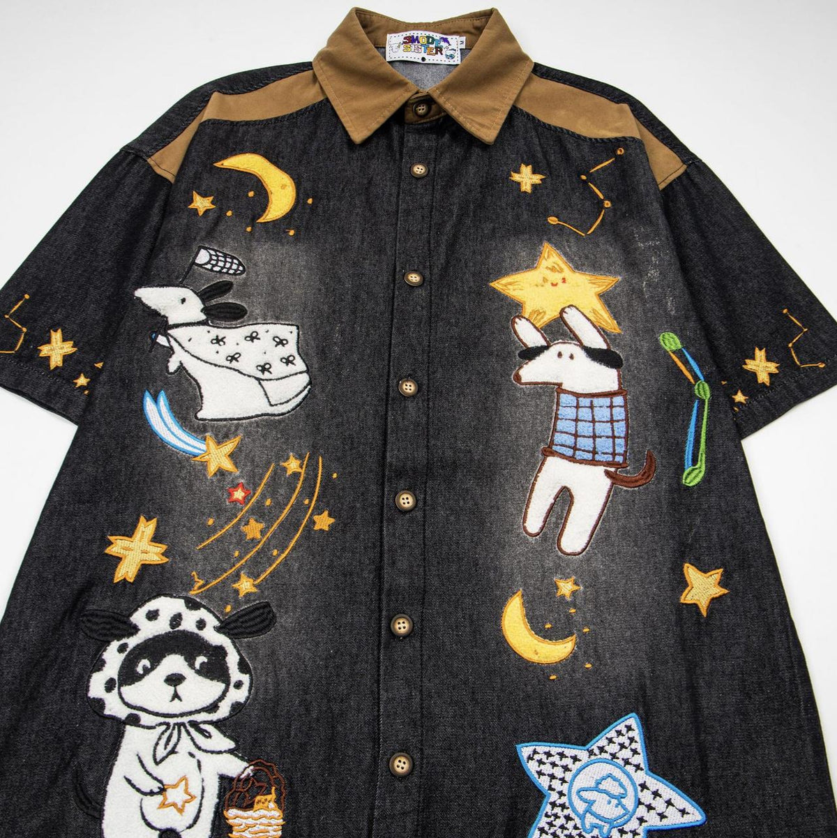Dog embroidered denim short-sleeve pet shirt with brown collar and whimsical celestial designs