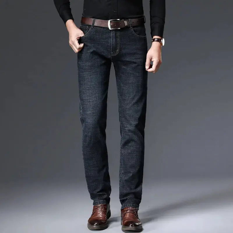 Premium denim jeans with dark wash, slim-straight stretch fit for daily wear