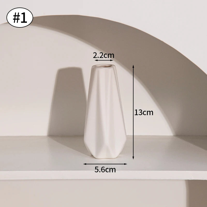 Ceramic flower vase, white geometric faceted design, 13cm tall with a 5.6cm base and 2.2cm opening.