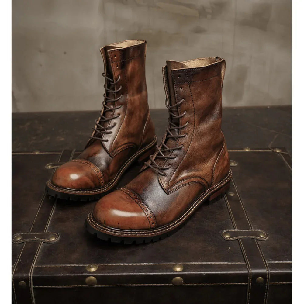 Pair of brown genuine leather western motorcycle boots with lace-up front.