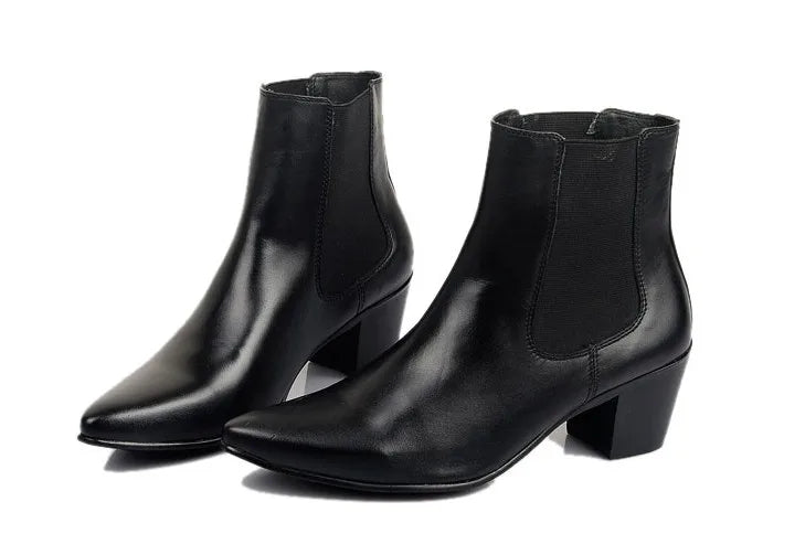 Pair of men's black leather Chelsea ankle boots with pointed toe, elastic side panels, and block heels.