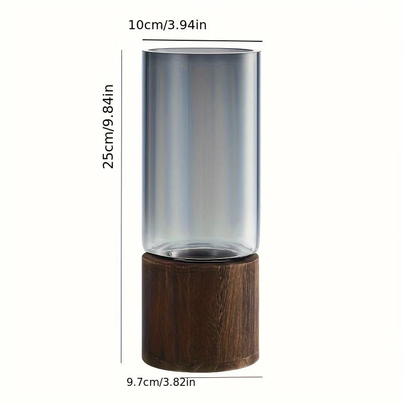 Elegant glass vase with a dark wooden base for hydroponic plants; modern tabletop decor