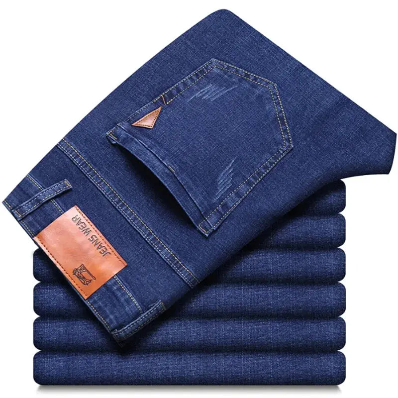 Denim jeans, premium dark wash, slim straight stretch fit, folded stack with back pocket and leather patch
