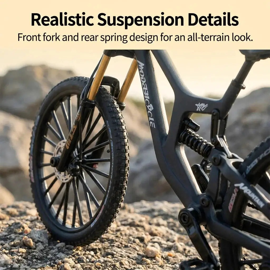 European 1:8 alloy mountain bike model with dual suspension; black frame, gold front fork, disc brakes on rocky terrain