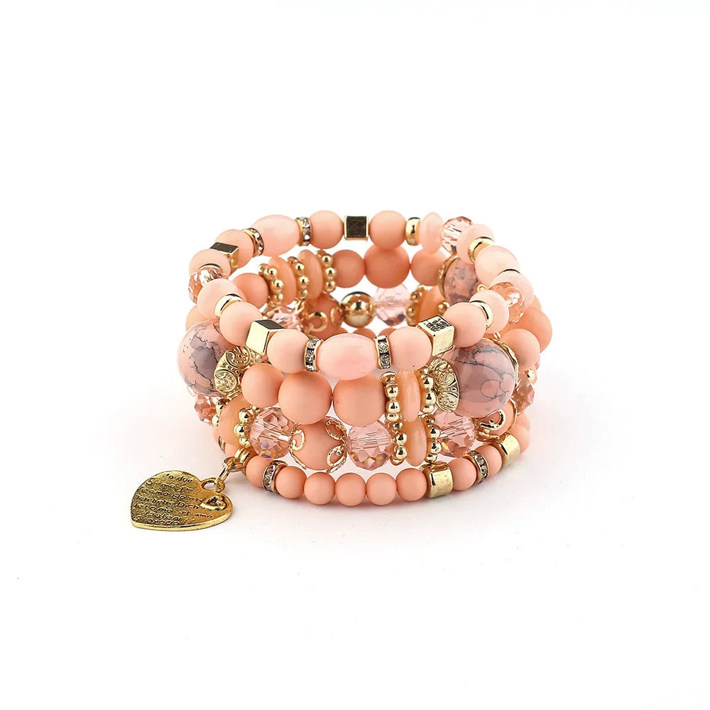 Boho crystal heart bracelet set, stackable peach-pink beaded elastic bracelets with gold accents and heart charm