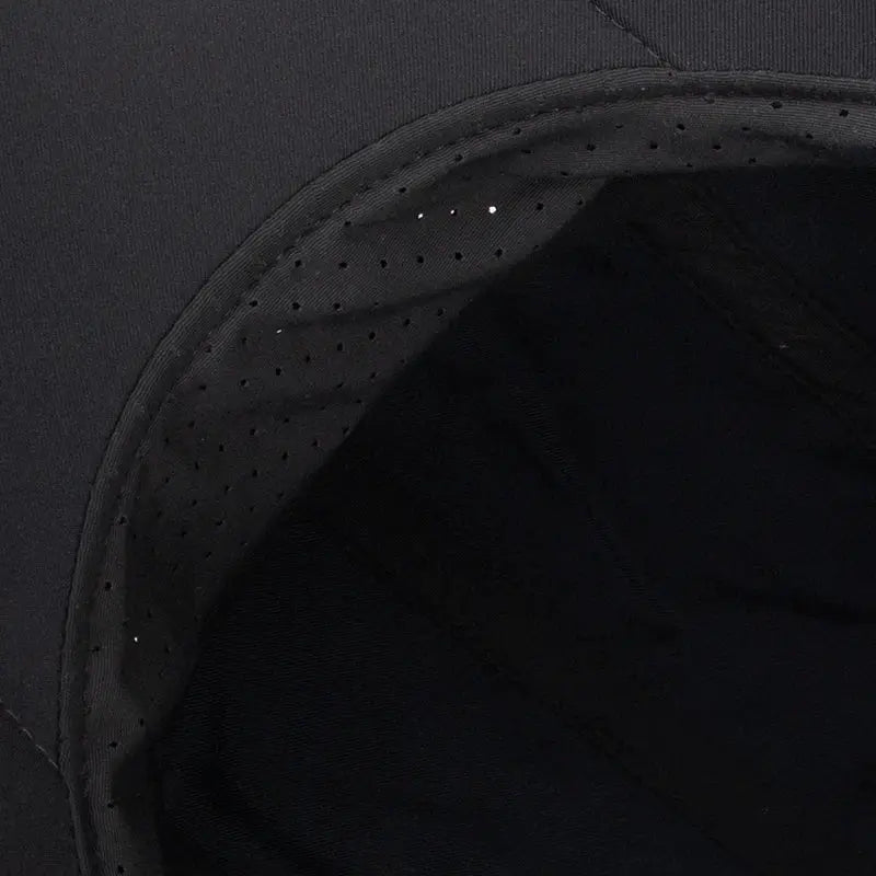 Baseball cap interior in black with perforated lining.