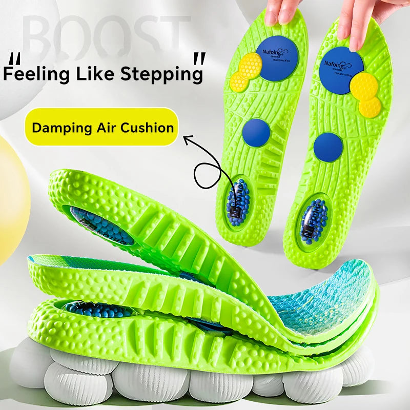 Orthopedic sport insoles neon green with blue cushioning discs; breathable high-elasticity pair