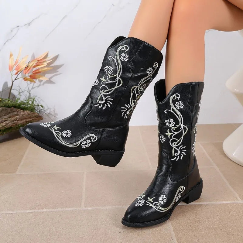 Western cowboy boots with embroidered floral vines on black leather, pointed toe, block heel