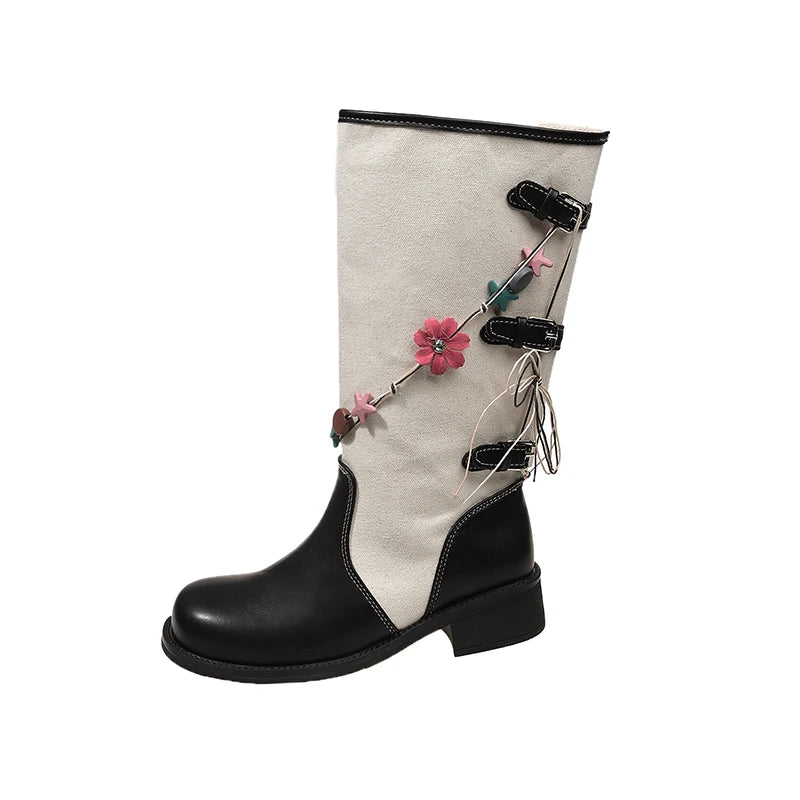 Wide calf Western cowboy boot with black square toe, beige shaft, chunky heel, and floral garland embellishments