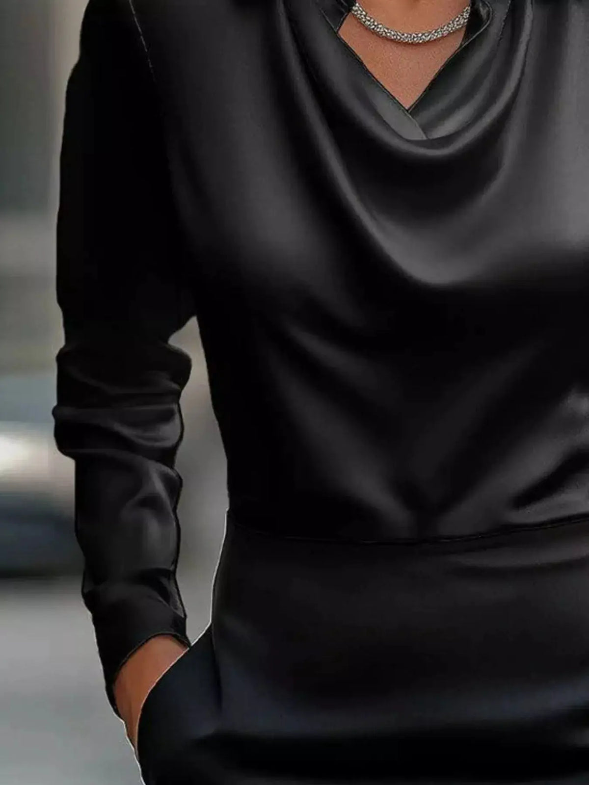 Plus-size satin cowl-neck blouse in black with long sleeves.