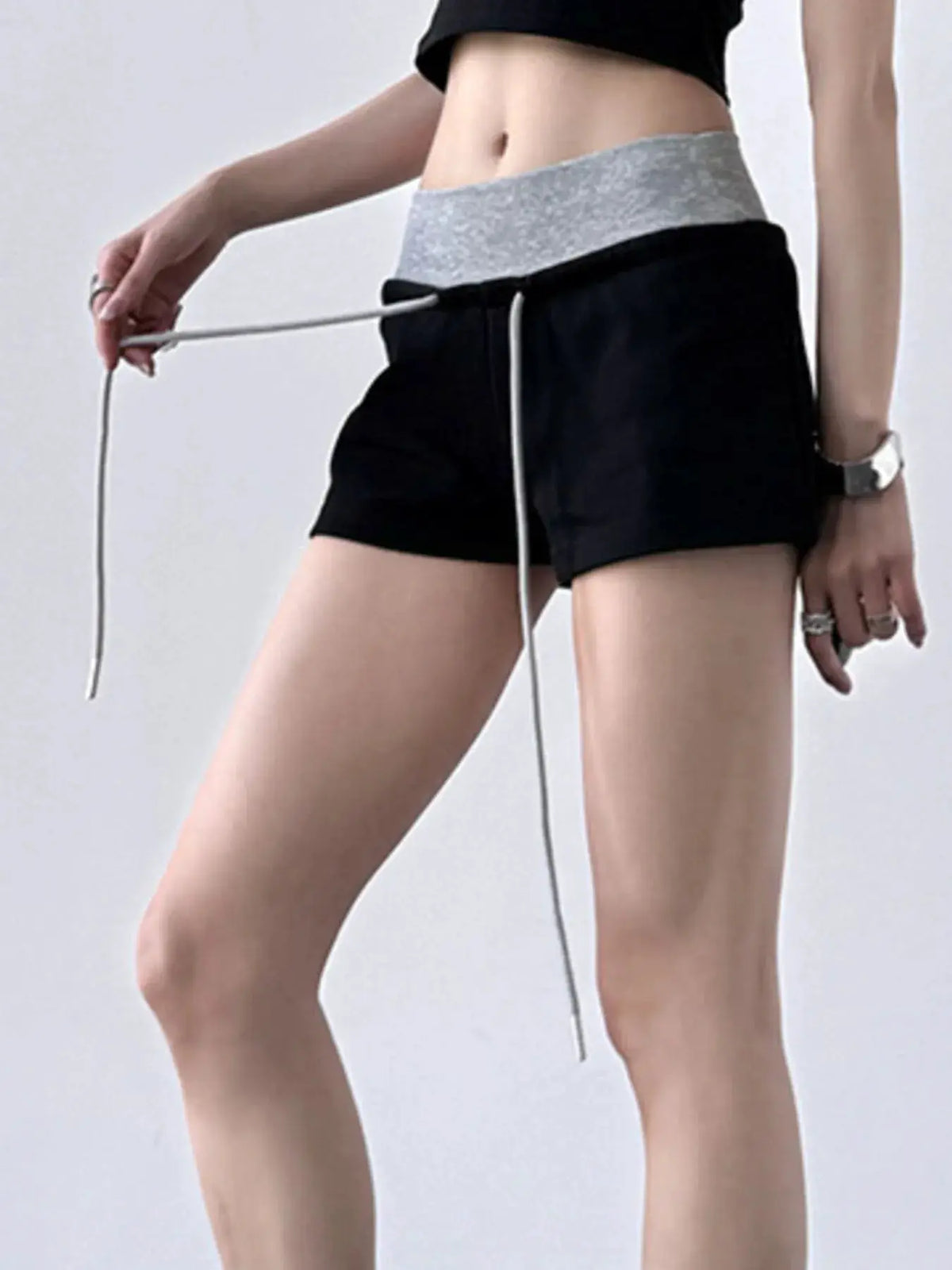 Drawstring shorts with gray contrast waistband in black by Trendsi