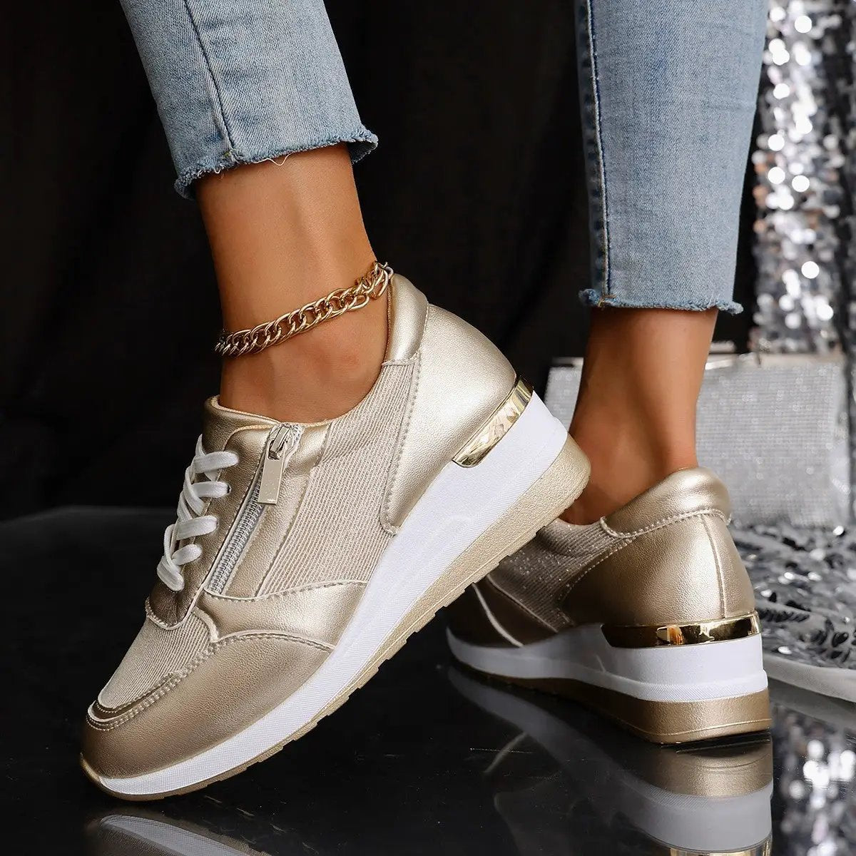 Women's lace-up casual sneakers with side zipper, metallic gold finish and thick white sole