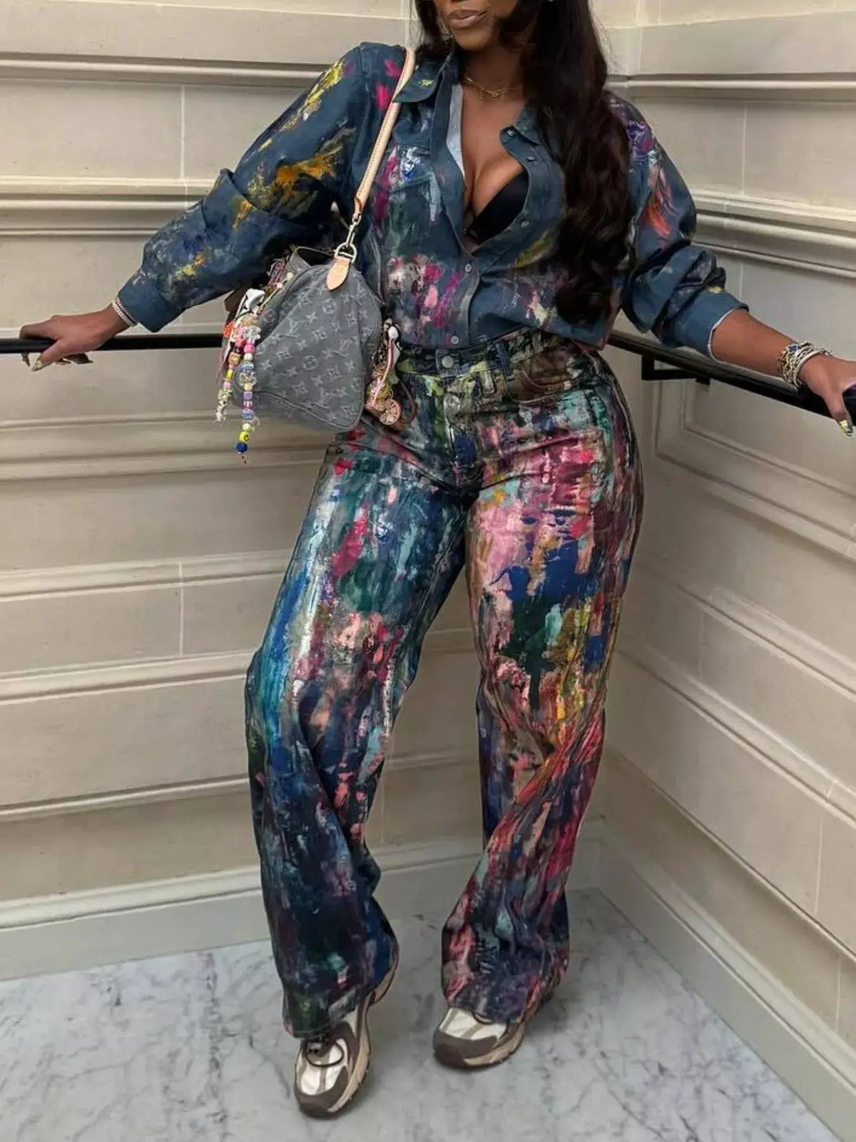 Women's hand-painted denim shirt, long sleeves, colorful brushstroke pattern; Louis Vuitton bag visible