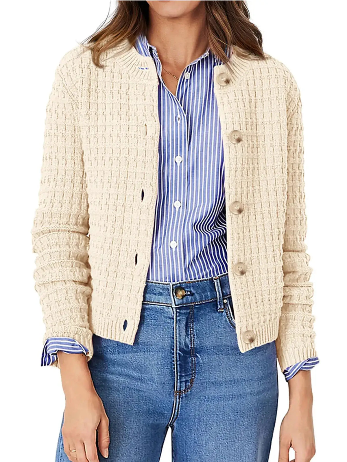 Textured stretchy knit cardigan in beige with button front, worn over a blue striped shirt