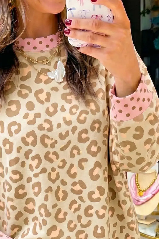 Leopard print sweatshirt with pink polka-dot accents