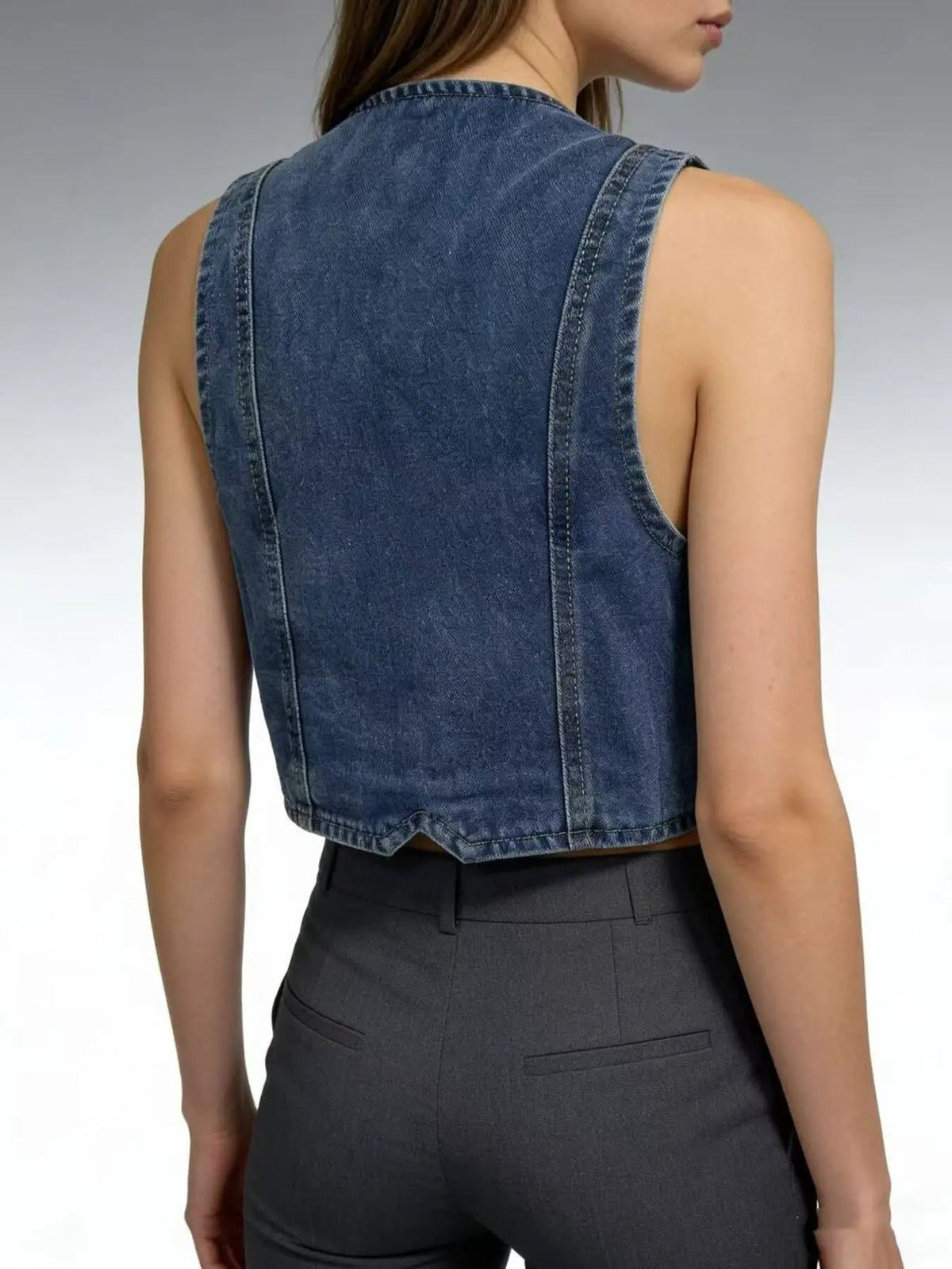 Blue denim vest, sleeveless and unlined; lightweight outerwear, back view with visible seams