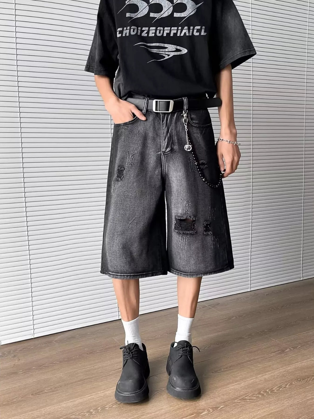 Men's distressed wide-leg denim shorts with drawstring, dark denim wash, knee-length, belt and chain