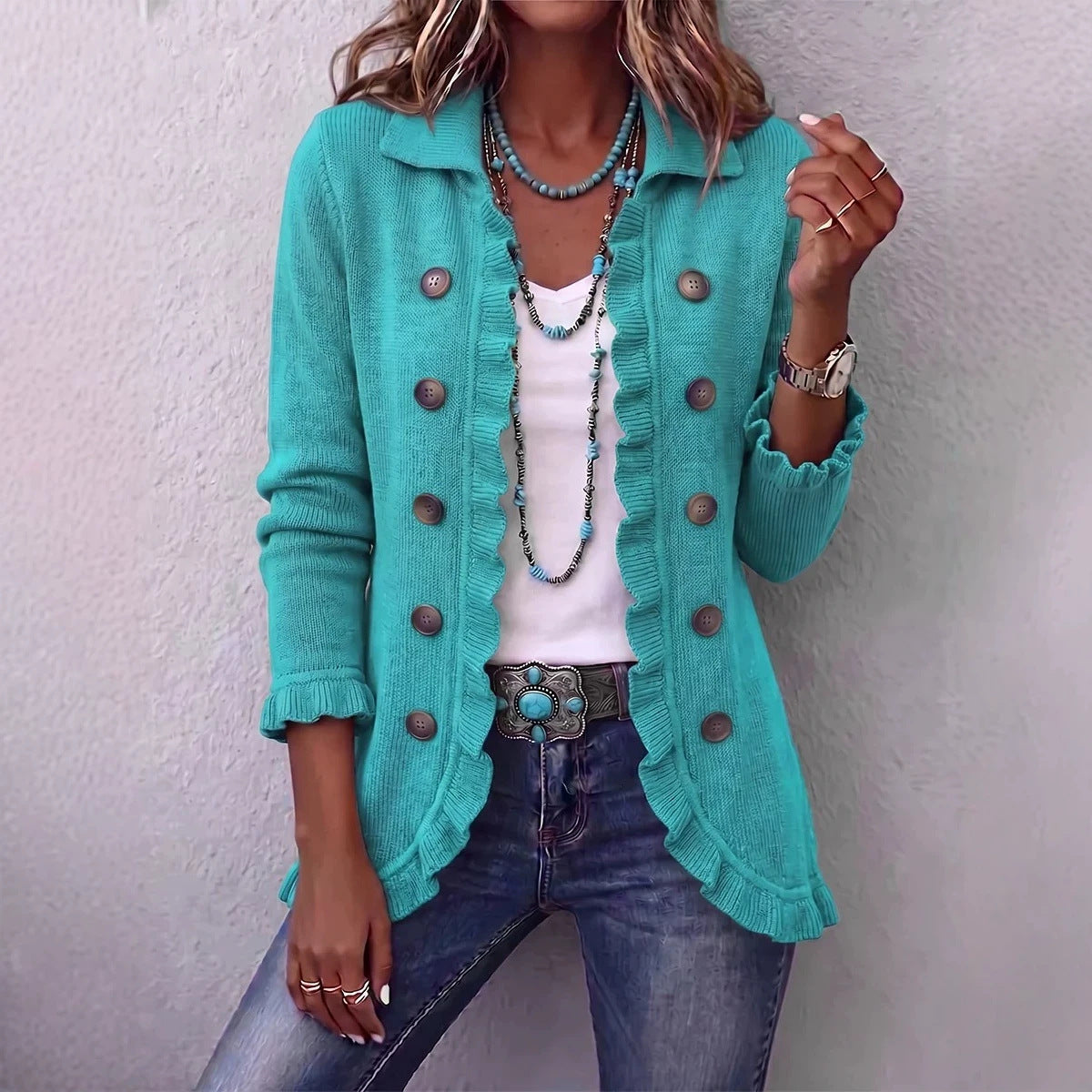 Long turquoise cardigan by AdTec with ruffled edges and large front buttons.