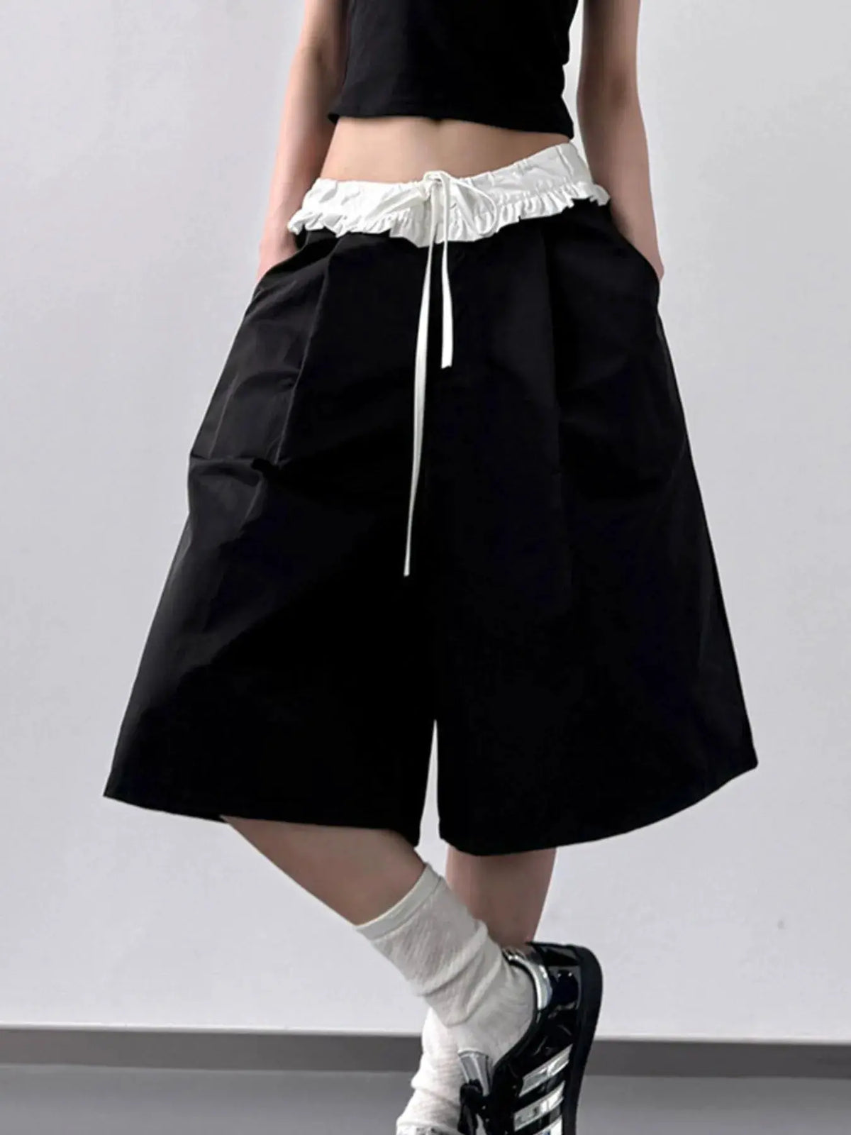 Contrast Waistband Wide-Leg Shorts in black with white drawstring waist and pockets.