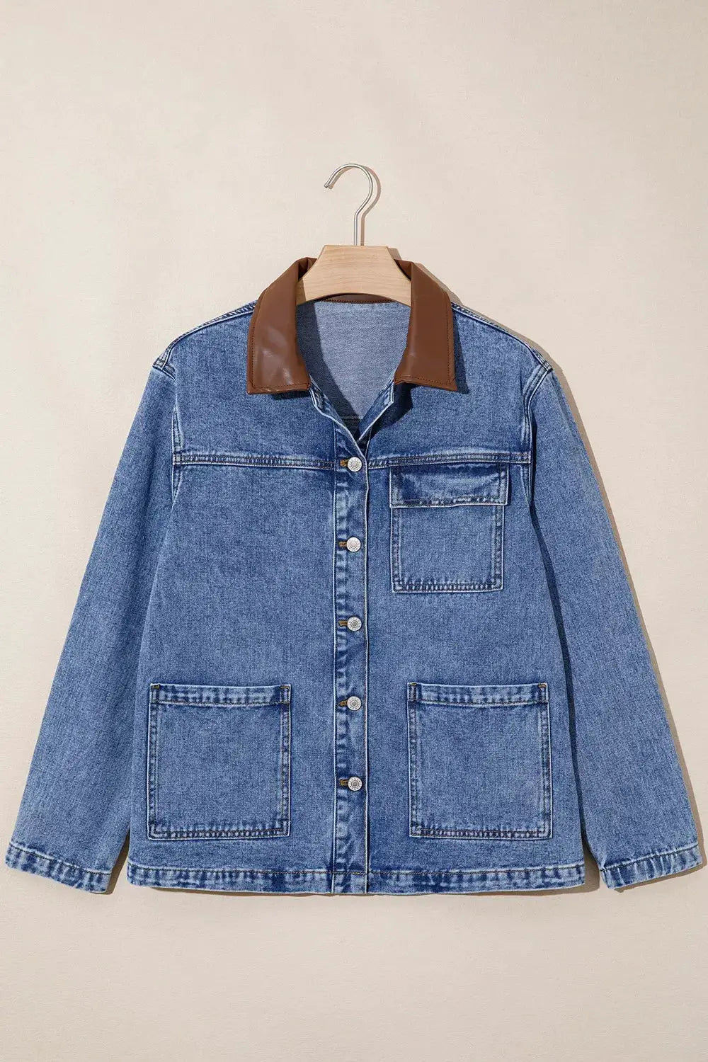Denim jacket with brown leather collar, button-front closure, blue wash, patch pockets