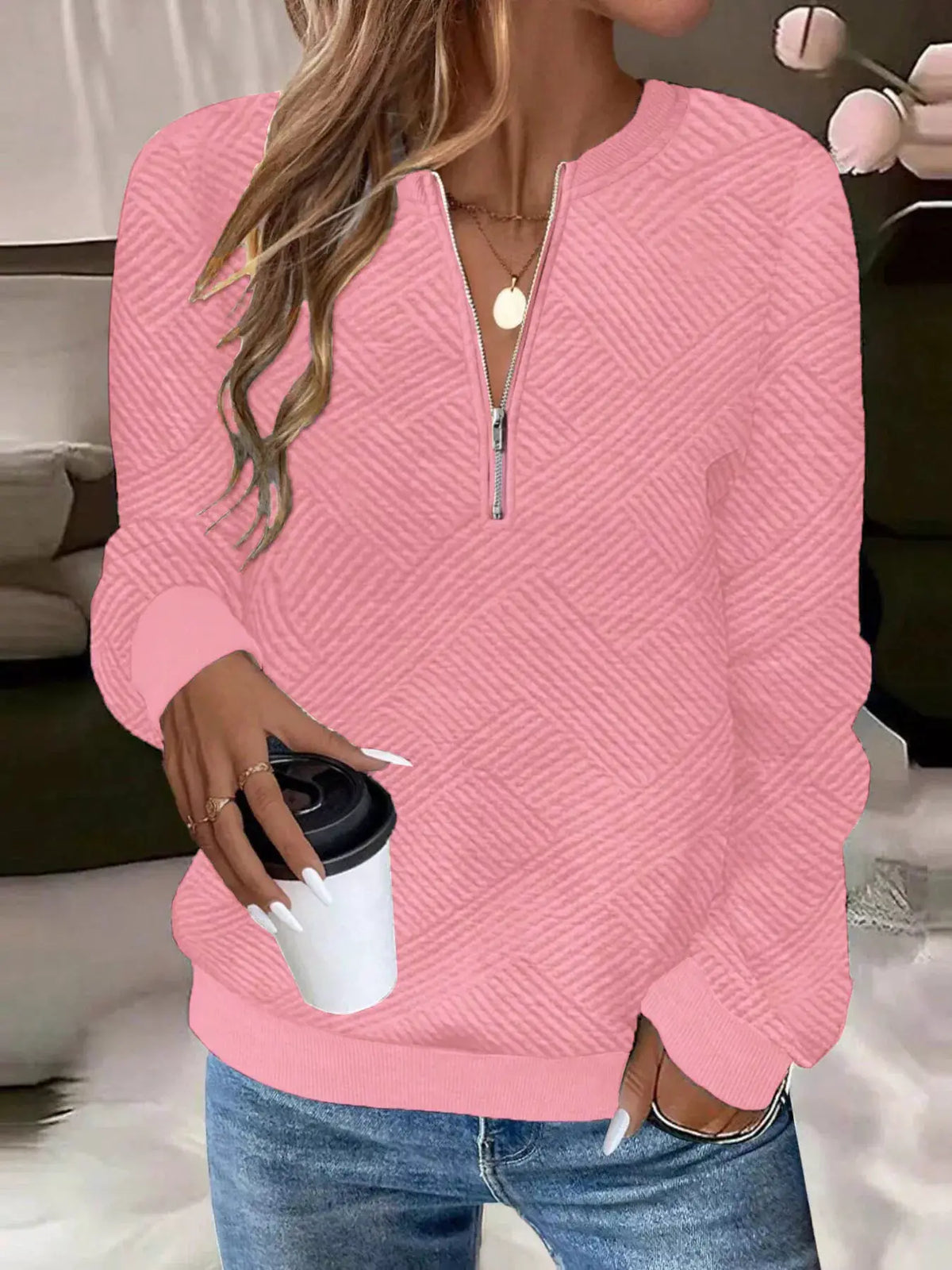 Textured pink quarter-zip sweatshirt with quilted diagonal pattern