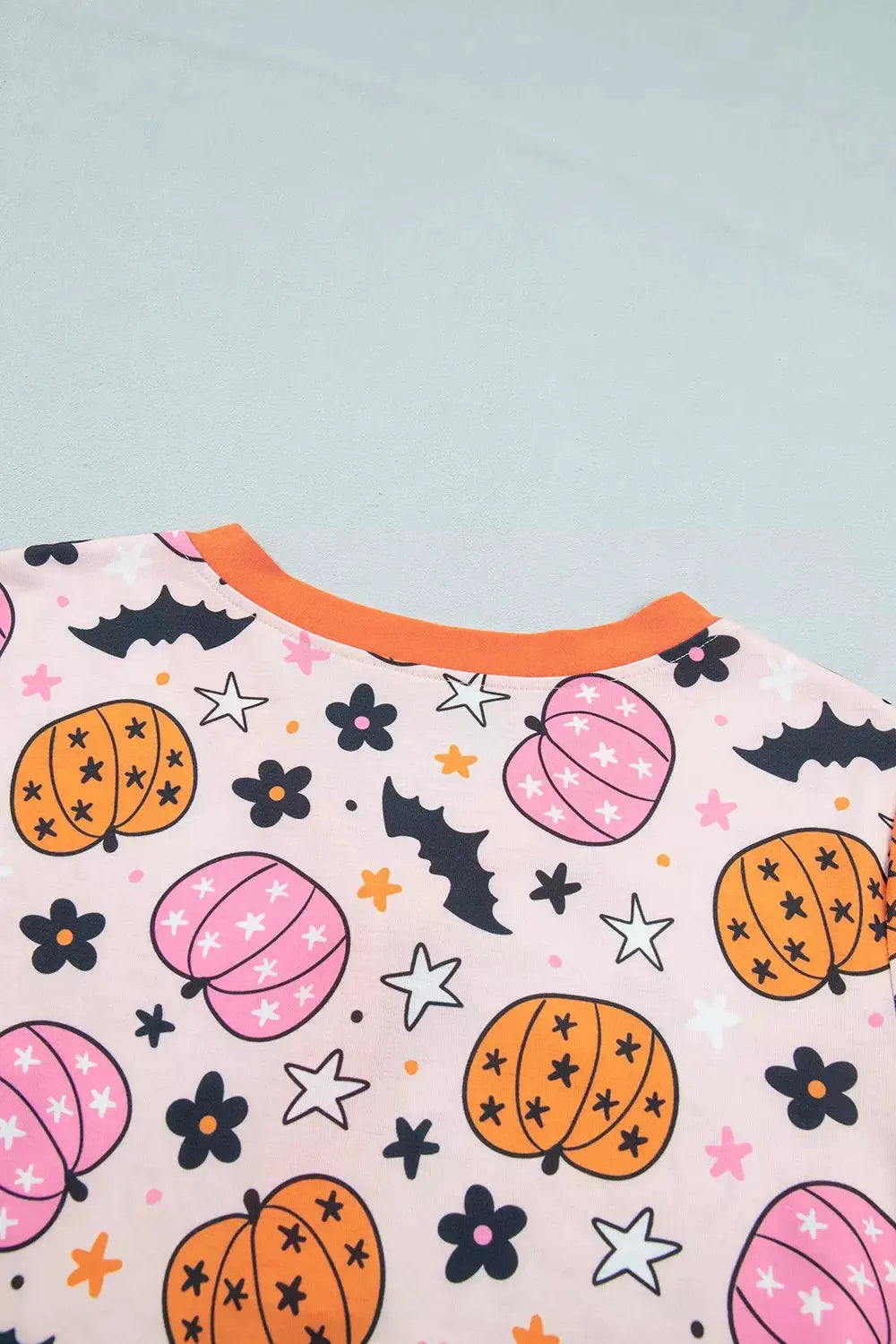 Halloween pumpkin print long-sleeve lounge set in pink with orange pumpkins and orange neckline trim