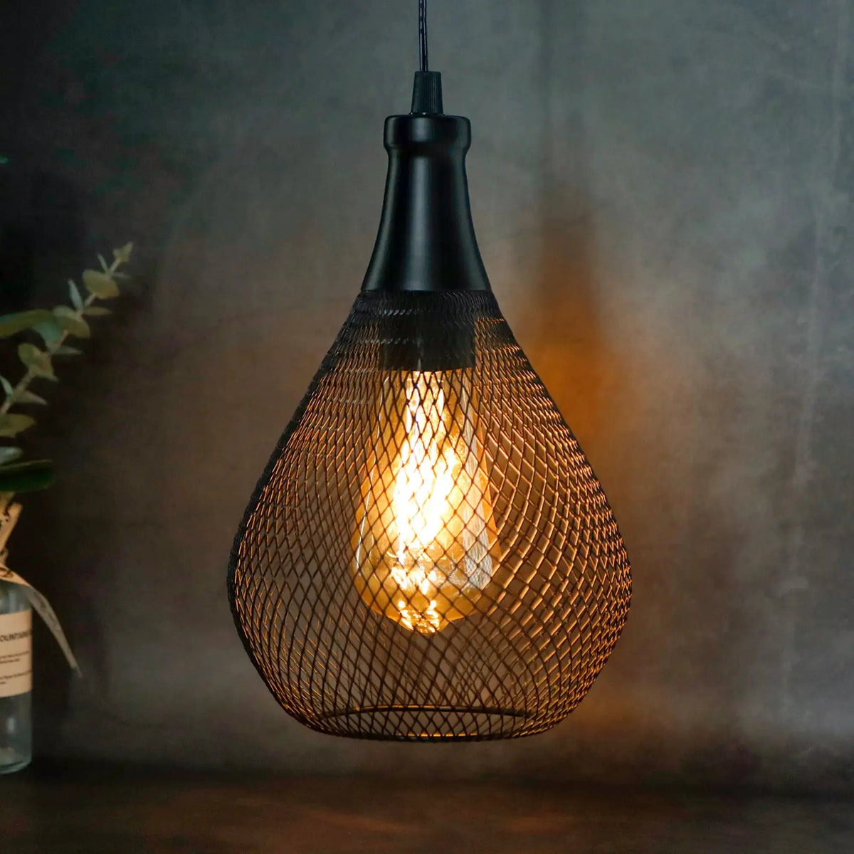 Battery operated hanging lamp by JHY DESIGN with black metal mesh shade and warm glow.