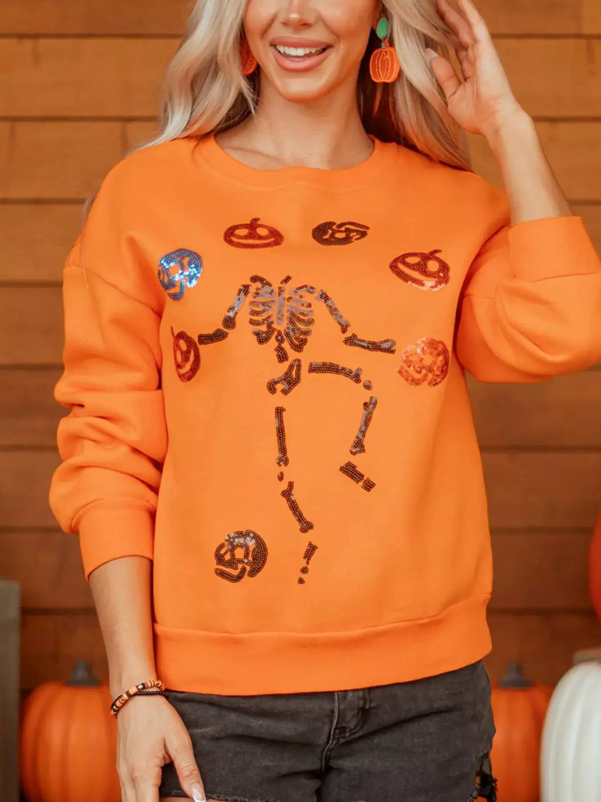 Dancing Critters Sequin Halloween Crewneck Sweatshirt in orange with sequined skeleton and pumpkin motifs