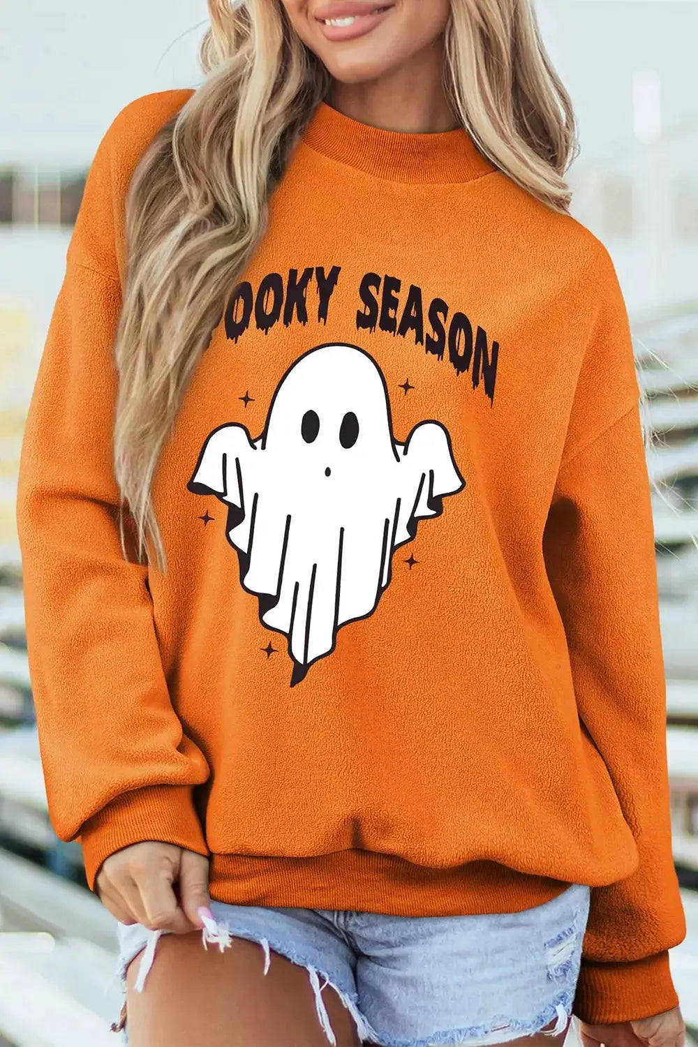 Spooky Season mock neck reversible Halloween sweatshirt, orange fleece with ghost graphic.