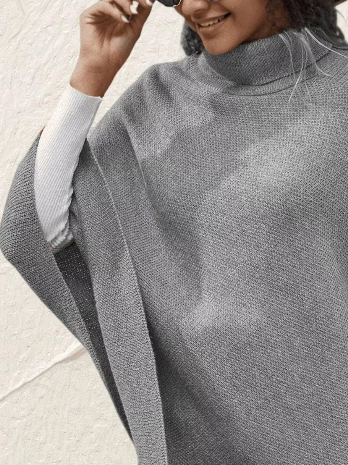 Grey knit turtleneck poncho pullover with adjustable windproof stretchy fit