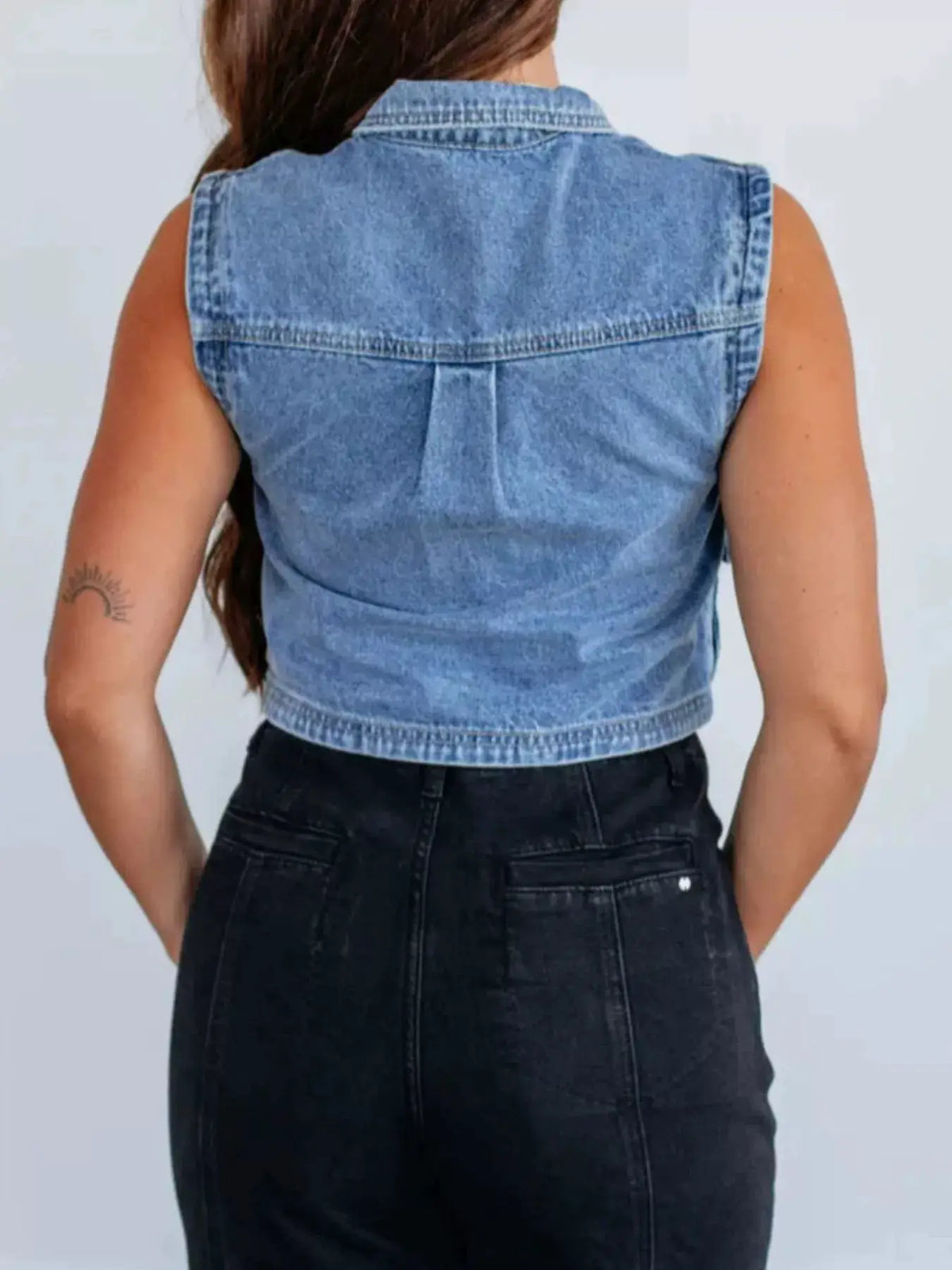 Sleeveless cropped denim vest by Trendsi in light wash, back view.