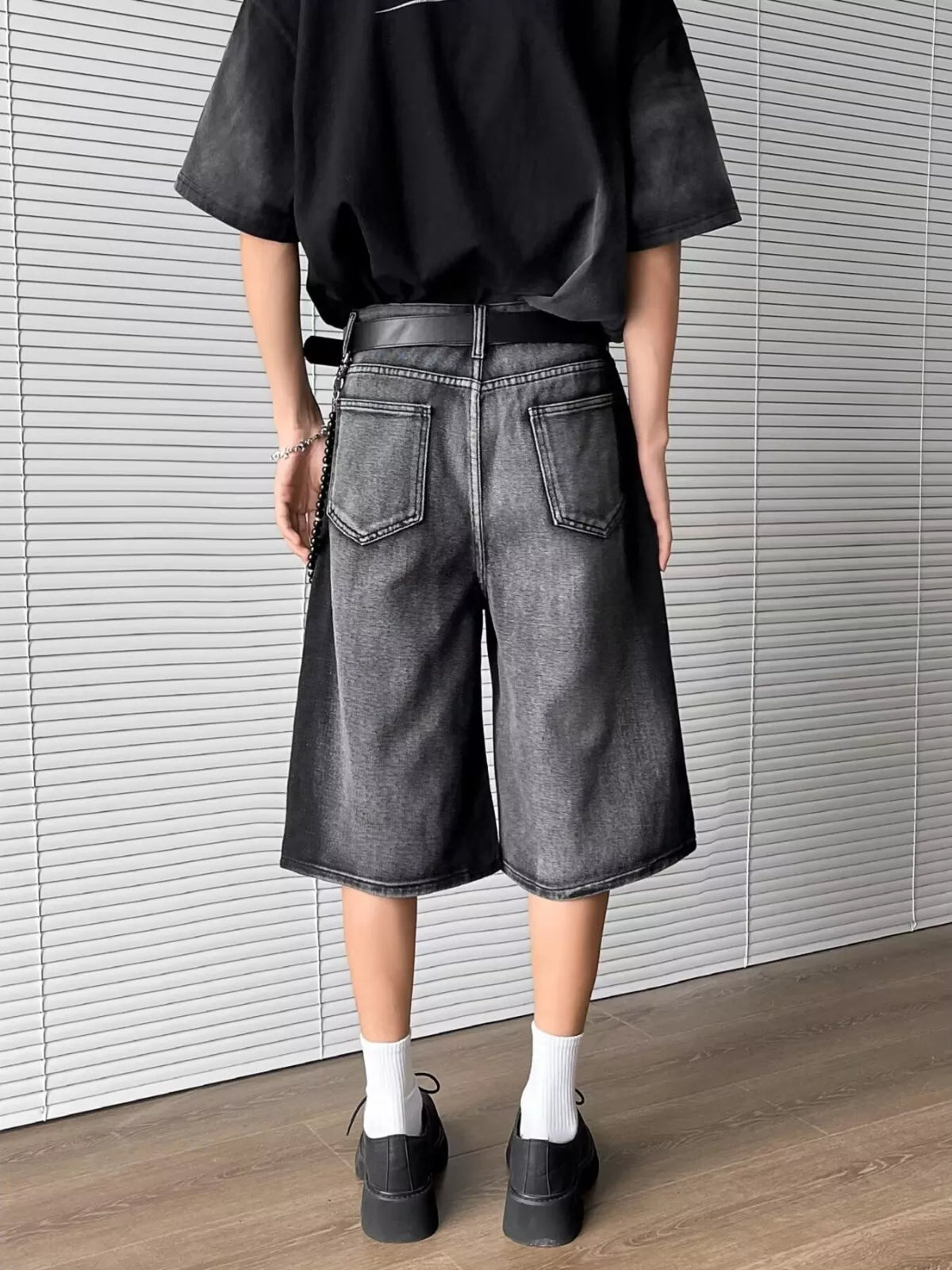 Men's full-size distressed wide-leg denim shorts with gray wash and back pockets, by Trendsi