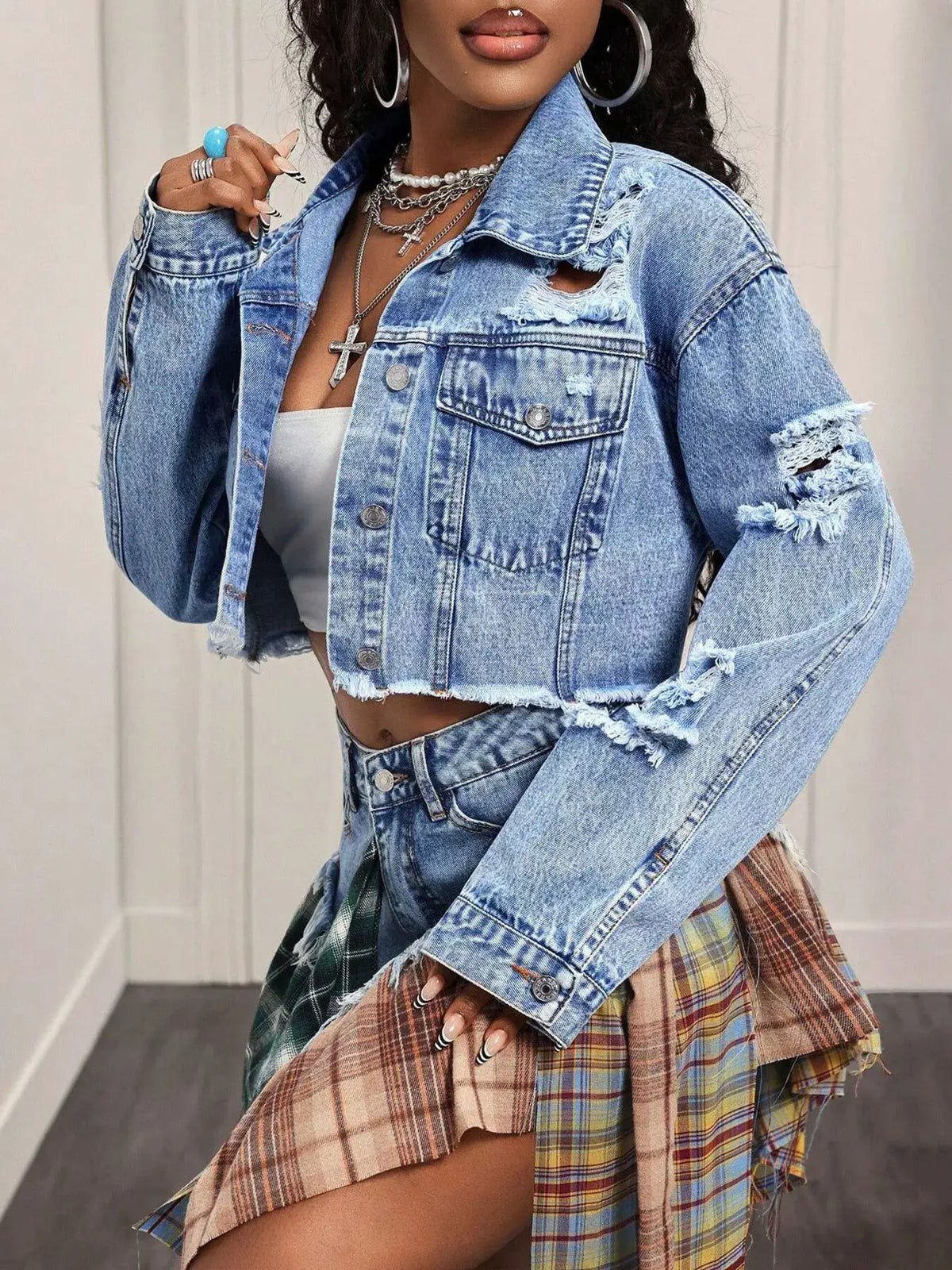 Distressed cropped denim jacket by Trendsi, light blue with ripped shoulders and frayed hems