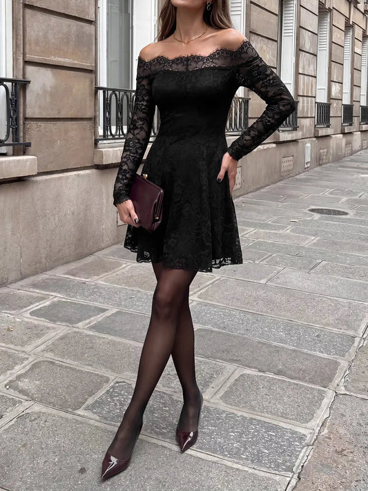 Black lace off-shoulder mini dress with long sheer sleeves, worn with a burgundy clutch and pointed burgundy heels.
