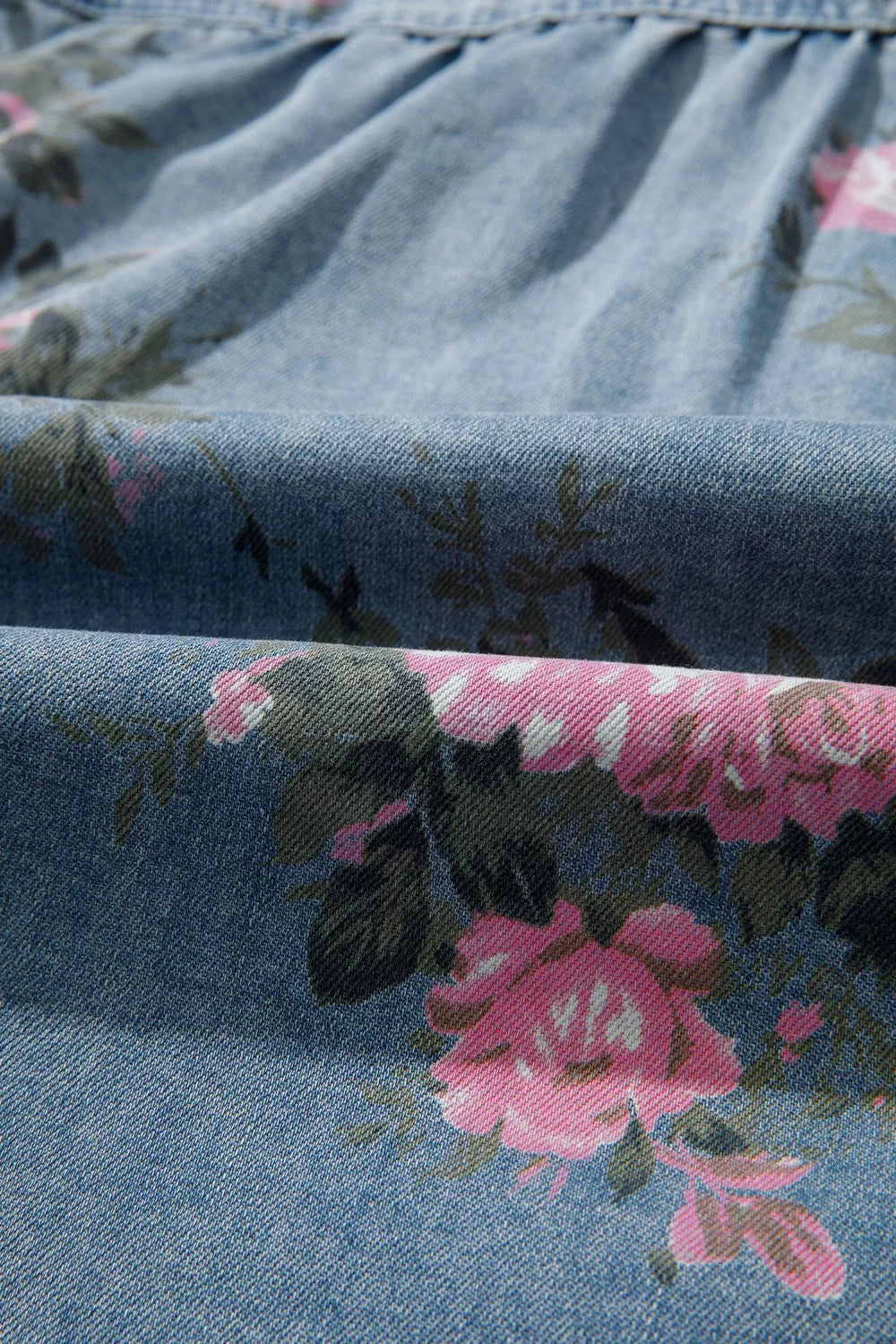 Floral print denim shirt; blue denim with pink flowers, cotton blend, button-up top